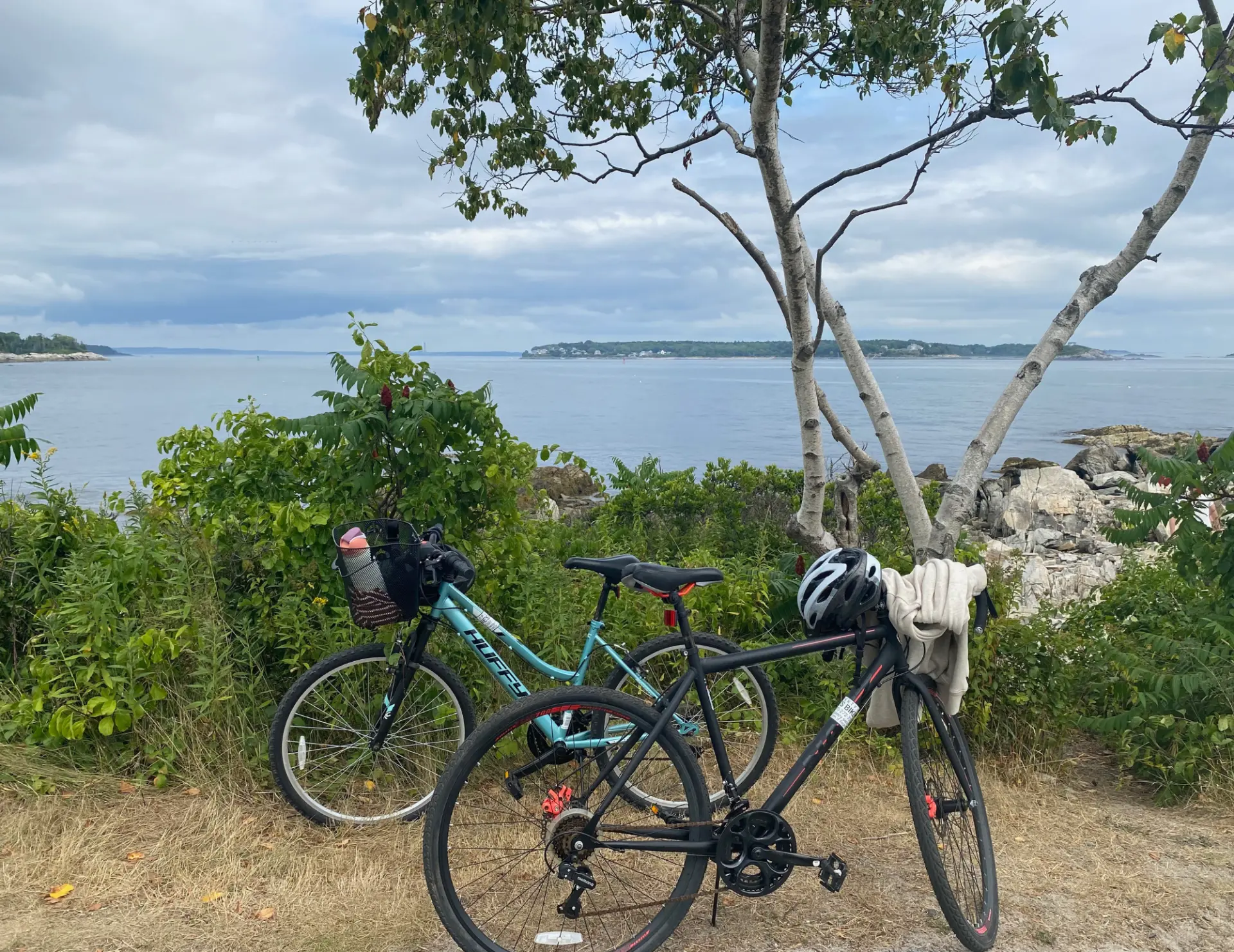 Two rental bikes overlooking the calm waters off Peaks Island, Maine