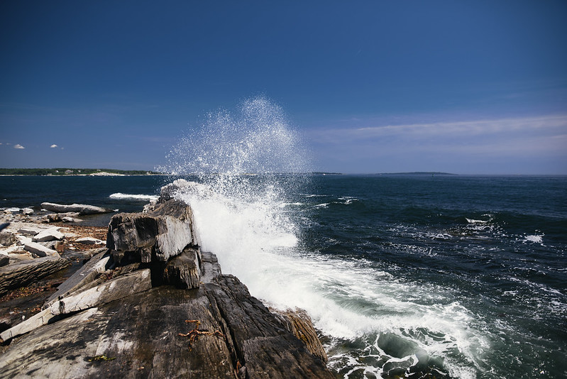 The Whaleback granite ledge stretching into the deep blue water off Peaks Island
